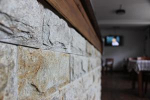 Μια τηλεόραση ή/και κέντρο ψυχαγωγίας στο Guest House Veni +18 φωτογραφίες