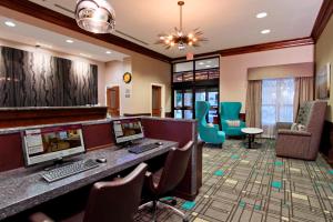 a hotel lobby with a computer desk and chairs at Residence Inn DFW Airport North/Grapevine in Grapevine