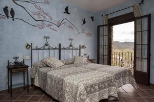 Łóżko lub łóżka w pokoju w obiekcie Aparthotel Rural 12 Caños