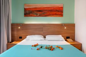 A bed or beds in a room at Hotel Pavlou