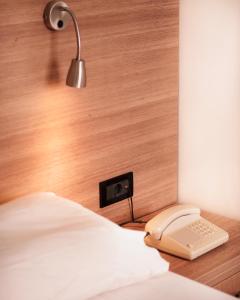 A bed or beds in a room at Hotel Pavlou