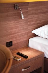 A bed or beds in a room at Hotel Pavlou