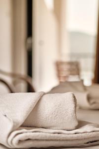 A bed or beds in a room at Hotel Pavlou