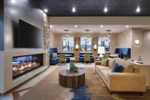 a living room with a couch and a fireplace at Residence Inn by Marriott Sedona in Sedona