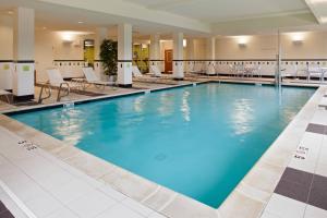 a large pool with blue water in a hotel lobby at Fairfield Inn & Suites by Marriott Wichita Downtown in Wichita