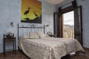 Łóżko lub łóżka w pokoju w obiekcie Aparthotel Rural 12 Caños