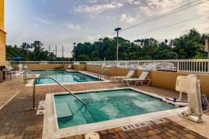 a swimming pool on the roof of a hotel at Fairfield Inn & Suites Palm Coast I-95 in Palm Coast