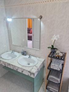 a bathroom with a sink and a mirror at Villa Toledo in Tías