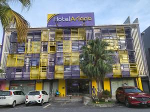 a hotel atrio with cars parked in front of it at Golden Leaf Boutique Hotel Nusa Idaman Branch in Johor Bahru
