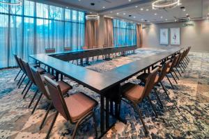a large conference room with a long table and chairs at Residence Inn Boston Downtown/South End in Boston