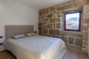 Postel nebo postele na pokoji v ubytování Carvalho Village