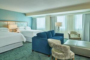 Cama ou camas em um quarto em Walt Disney World Dolphin