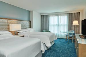 Cama ou camas em um quarto em Walt Disney World Dolphin