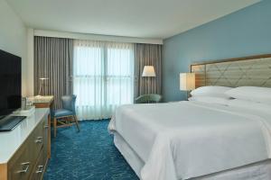 Cama ou camas em um quarto em Walt Disney World Dolphin