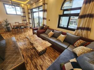 a living room with a couch and a table at Sora Addis BnB in Addis Ababa