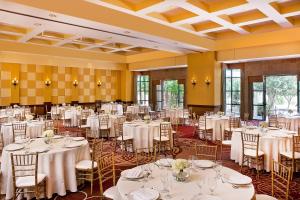 a banquet hall with white tables and chairs at Sheraton Phoenix Crescent in Phoenix