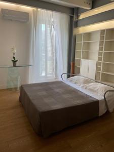 A bed or beds in a room at Casa Giulietta - ombrellone e 2 lettini inclusi