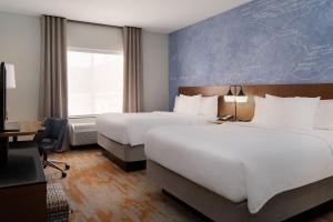 Postel nebo postele na pokoji v ubytování Fairfield Inn & Suites by Marriott Moab