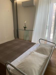 A bed or beds in a room at Casa Giulietta - ombrellone e 2 lettini inclusi