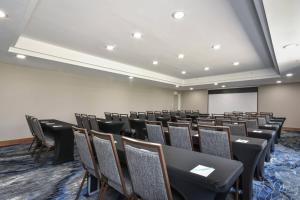 a conference room with chairs and a projection screen at Fairfield Inn by Marriott Columbia Northwest / Harbison in Columbia