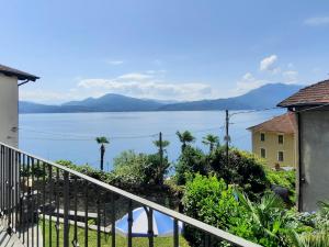 a view of the water from the balcony of a house at Appartamento Porto 2 in Cannero Riviera