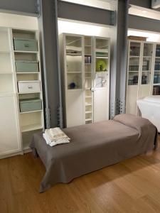 A bed or beds in a room at Casa Giulietta - ombrellone e 2 lettini inclusi