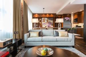 a living room with a couch and a table at JW Marriott Houston Downtown in Houston