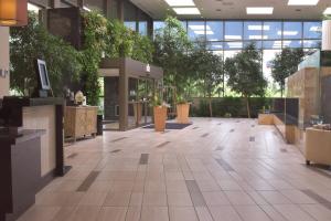 an empty lobby with plants in a building at Indianapolis Marriott East in Indianapolis