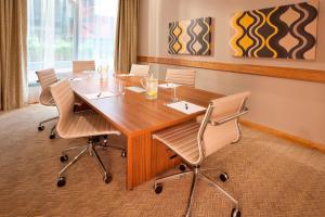 a conference room with a wooden table and chairs at Residence Inn by Marriott Edinburgh in Edinburgh