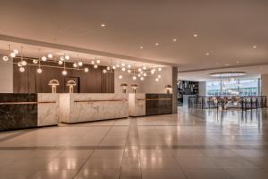 a lobby of a building with a reception desk at Sheraton Frankfurt Airport Hotel & Conference Center in Frankfurt