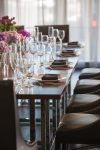 a long table with glasses and napkins on it at Renaissance Albany Hotel in Albany