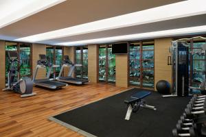 a gym with several treadmills and exercise machines at The Westin Resort & Spa Ubud, Bali in Ubud