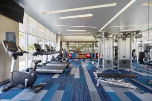 a gym with several treadmills and cardio machines at Aloft Queretaro in Querétaro
