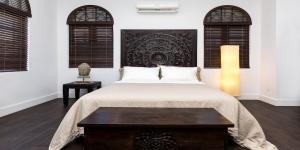 Postel nebo postele na pokoji v ubytování Vive Zen Queen Room