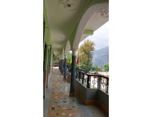 a view from the balcony of a building at Hotel Gaurishankar Palace, Barkot in Barkot