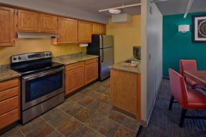 a kitchen with a stove and a refrigerator at Residence Inn by Marriott Hartford Downtown in Hartford