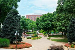 a park with trees and flowers and a building at Renaissance Atlanta Waverly Hotel & Convention Center in Atlanta