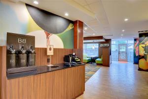 a lobby of a hotel with a coffee bar at Fairfield Inn & Suites by Marriott Nashville Downtown-MetroCenter in Nashville
