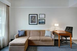 a living room with a couch and a table at Residence Inn by Marriott Morgantown Medical Center Area in Morgantown +42 photos