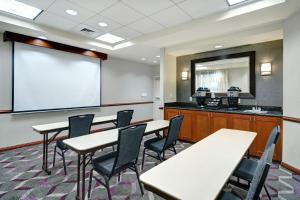 a classroom with tables and chairs and a whiteboard at Residence Inn by Marriott Morgantown Medical Center Area in Morgantown