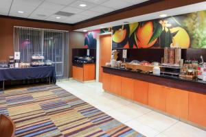 a restaurant with a counter and a buffet at Fairfield Inn and Suites by Marriott Seymour in Seymour