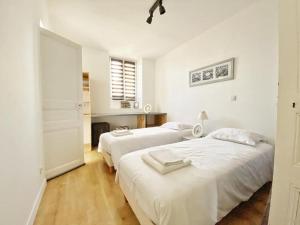 Posteľ alebo postele v izbe v ubytovaní Appt. T3 type Haussmannien vue mer sur port