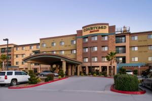 a hotel with a parking lot in front of it at Courtyard by Marriott Victorville Hesperia in Hesperia