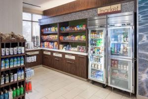 a store with a large refrigerator in a store at SpringHill Suites by Marriott Orlando at SeaWorld in Orlando