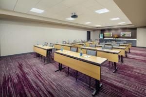 a classroom with rows of tables and chairs at Courtyard by Marriott Dayton North in Dayton