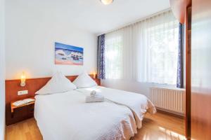 Säng eller sängar i ett rum på Appartementhaus Sonnenschein