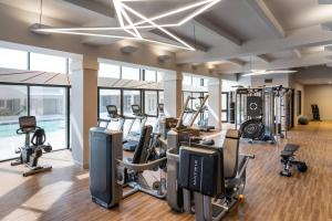 a gym with cardio equipment and treadmills in a building at Marriott Jacksonville in Jacksonville