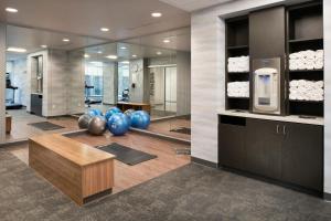 a lobby with a gym with blue exercise balls on the floor at Fairfield by Marriott Inn & Suites Memphis Arlington in Arlington