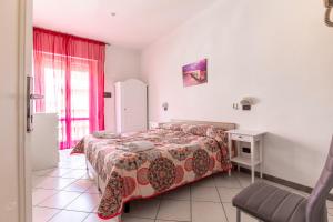 Postel nebo postele na pokoji v ubytování Hotel Paolina
