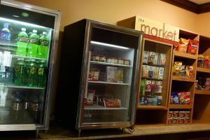 an open refrigerator in a store with drinks in it at Fairfield Inn & Suites Mount Vernon Rend Lake in Mount Vernon